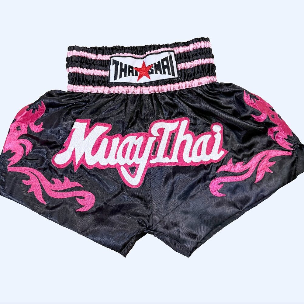 Authentic THAISMAI Muay Thai shorts in black and pink satin. Made in Thailand.